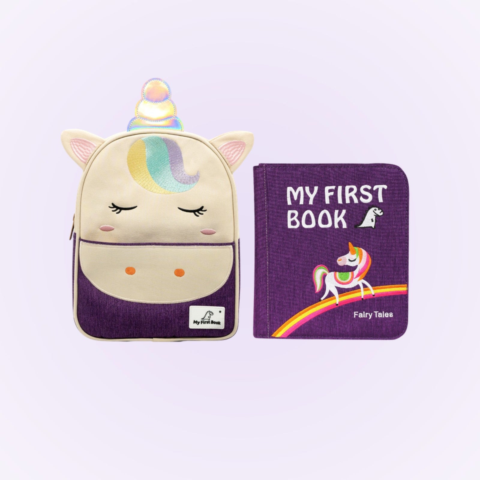 Märchenwelten Quiet Book mit Einhorn-Rucksack auf sanftem Lavendel-Hintergrund – ab 1 Jahr