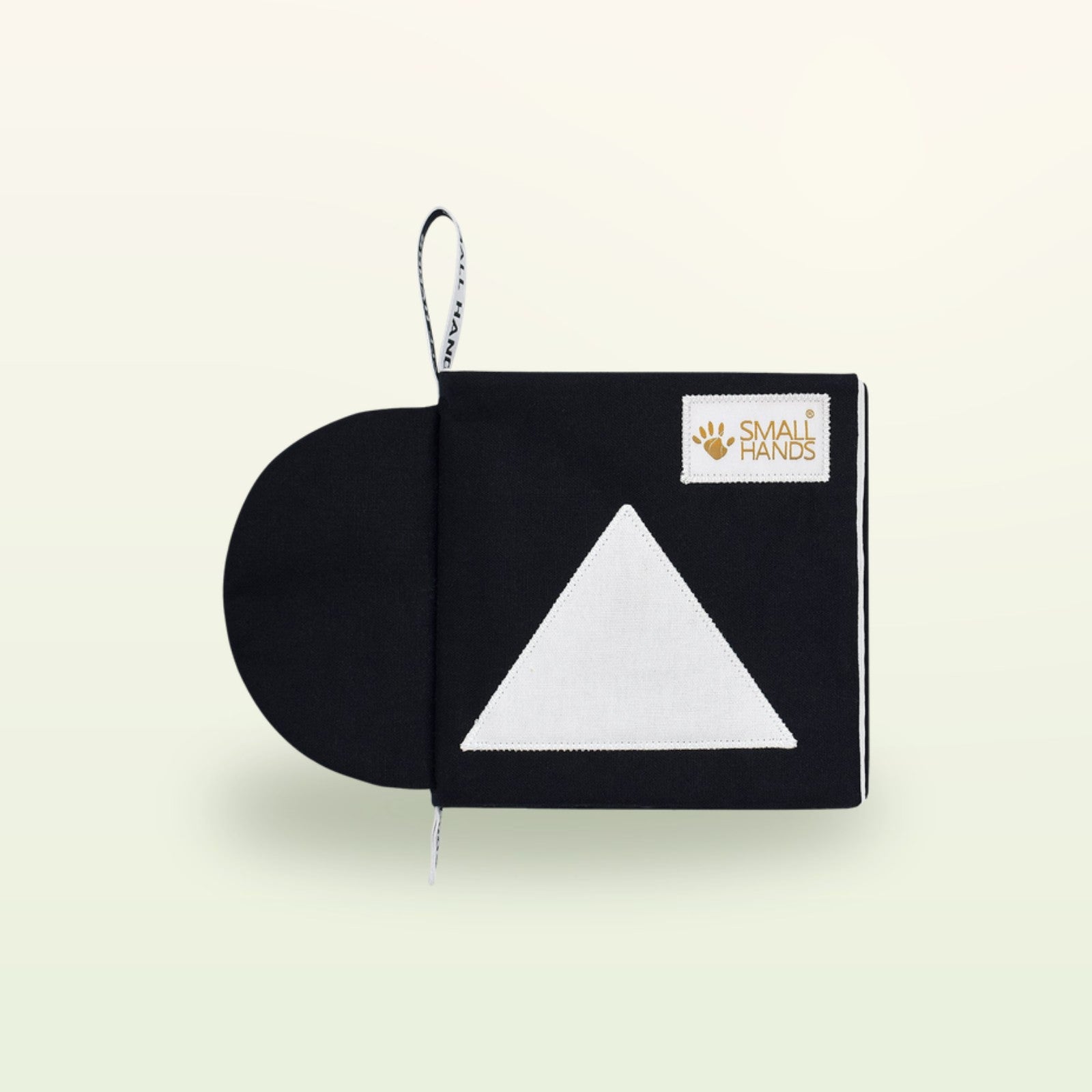 Small Hands Formen Montessori Kontrastbuch – schwarzer Einband mit weißem Dreieck auf sanftem Creme-Hintergrund – ab 0 Monaten